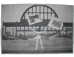 Holding Two Flags Across Westside Highway Facing Pier 54, 2015