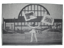 Holding Two Flags Across Westside Highway Facing Pier 54, 2015